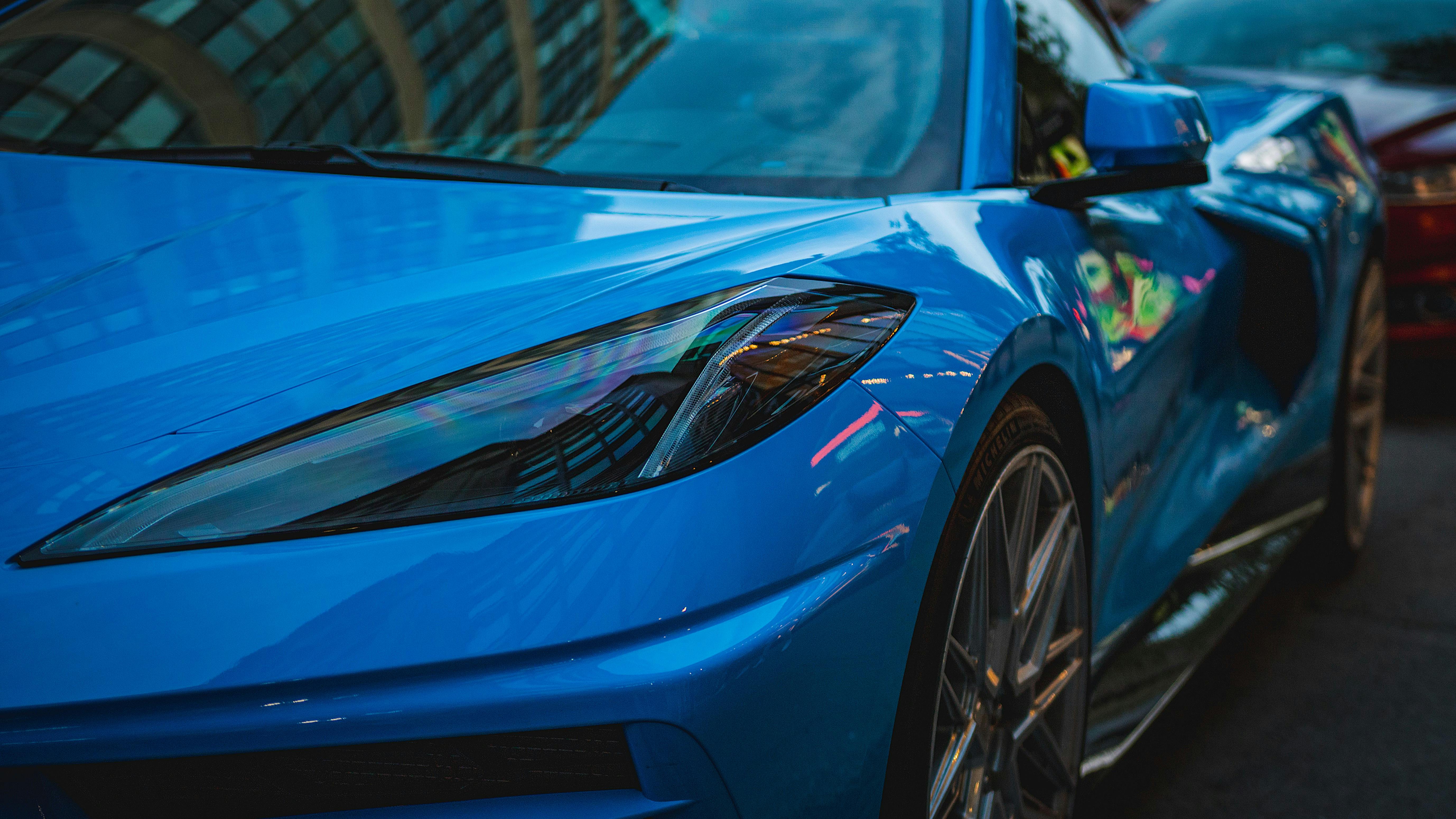 Flawless blue sports car paint finish after professional paint correction